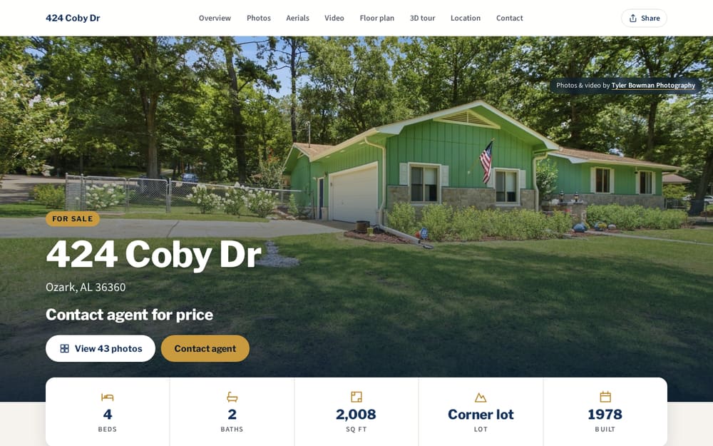 Property Website on a desktop screen: full-width listing photo of a green home at 424 Coby Dr, Ozark, with beds, baths, square footage and a View 43 photos button