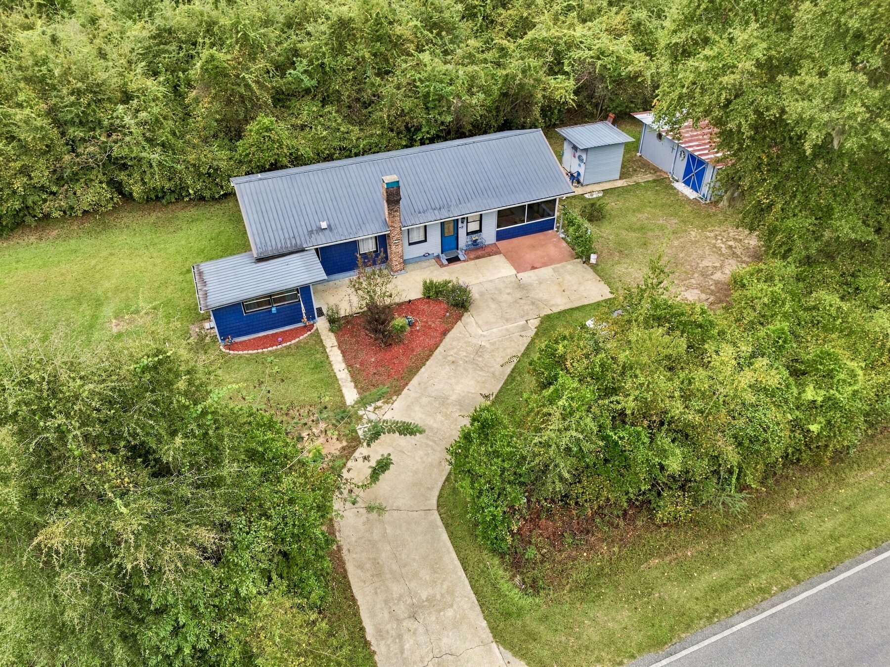 Wooded ranch home aerial drone photography by Tyler Bowman Photography